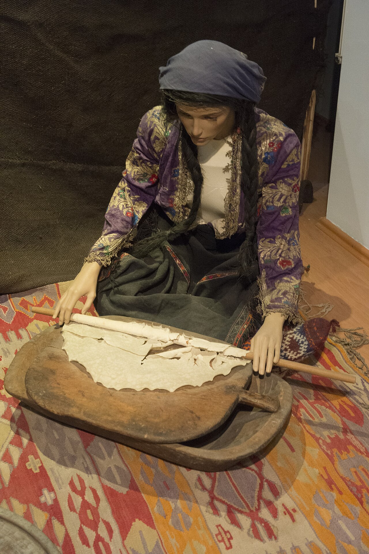 Gözleme being prepared on a griddle.