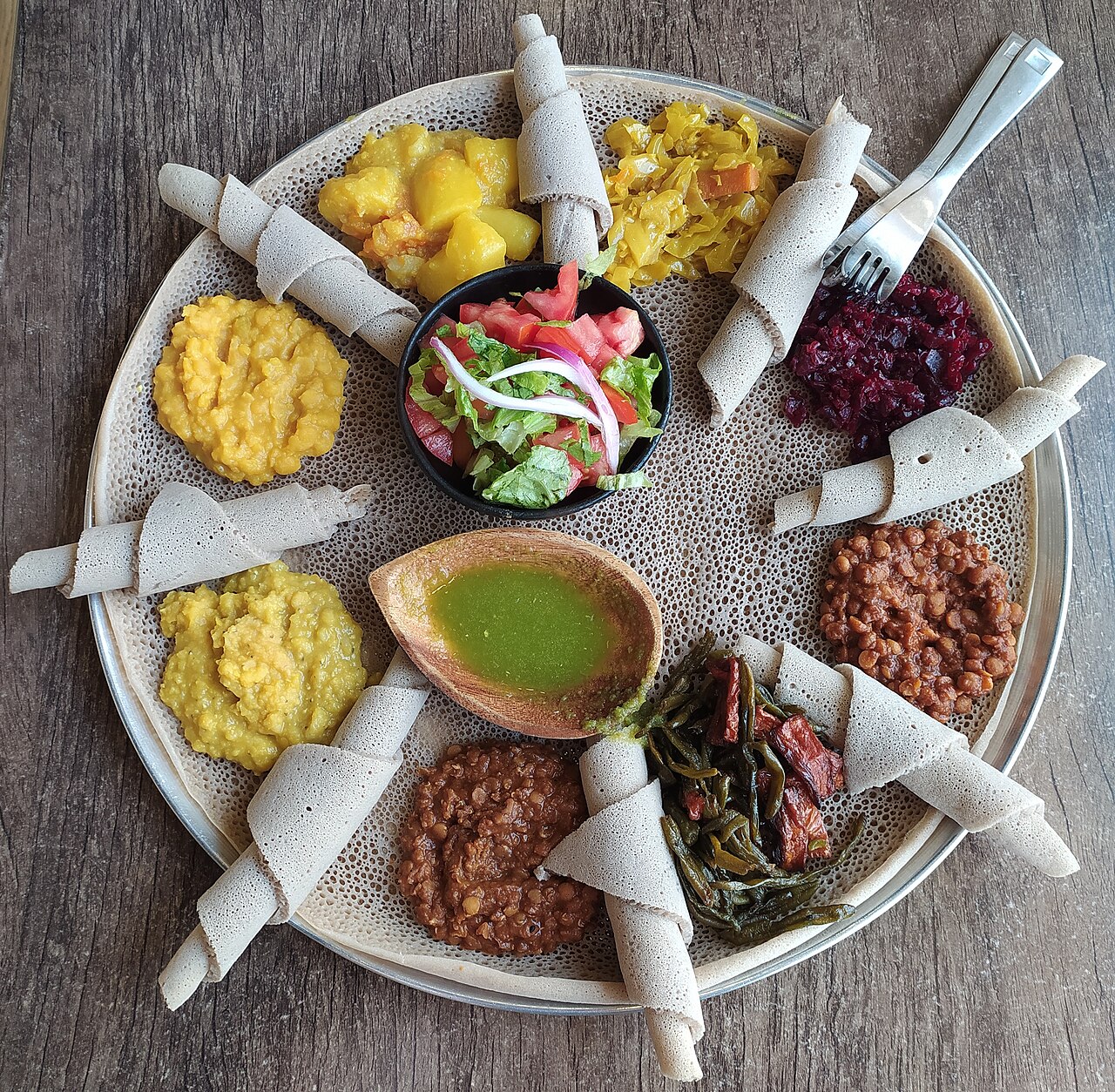 Injera served with eight kinds of stew.