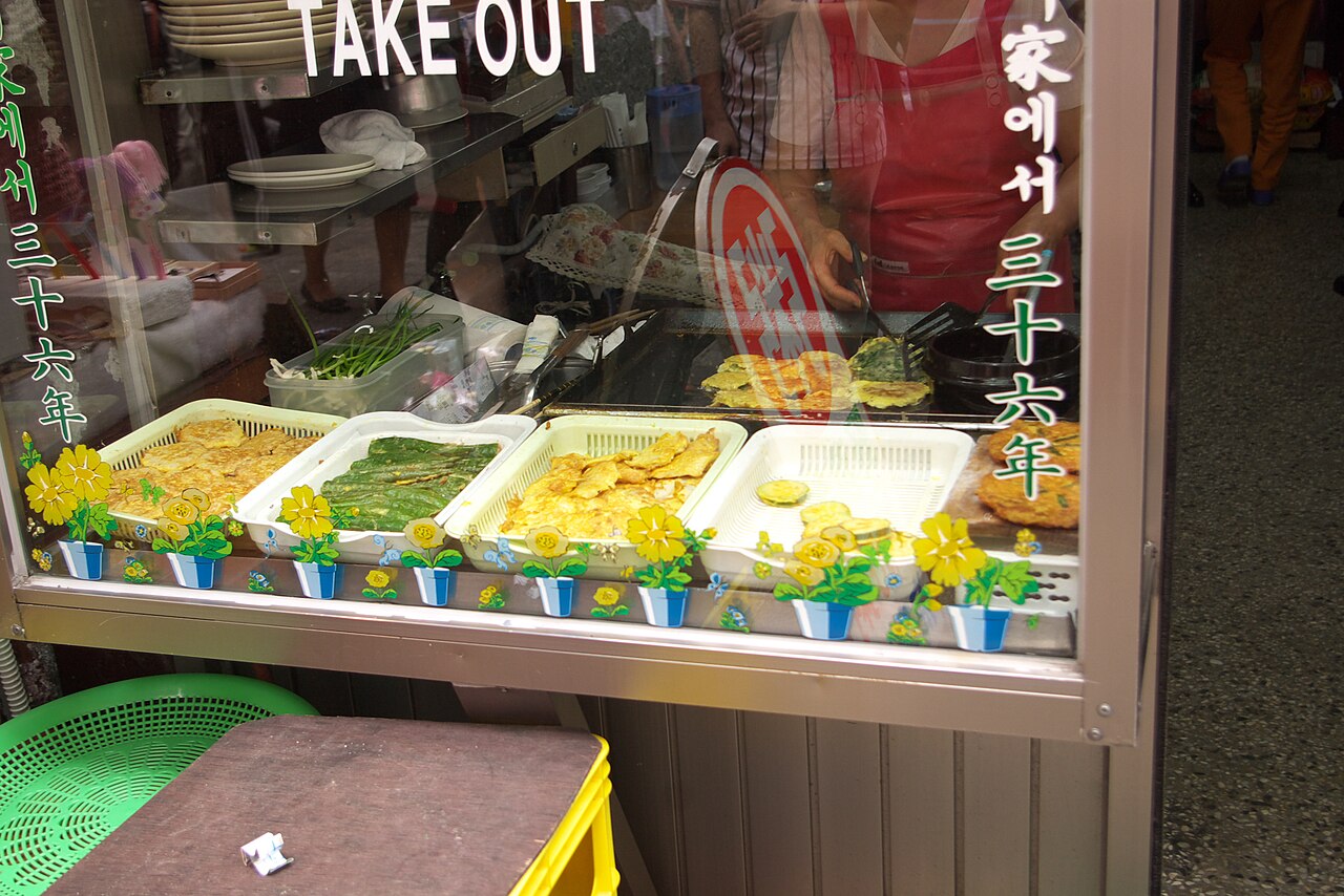 A shop display of assorted Korean jeon.