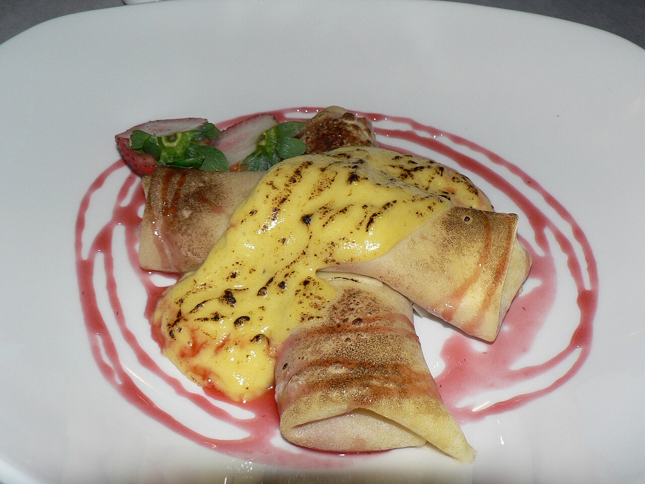 Crêpes with strawberries and zabaglione.